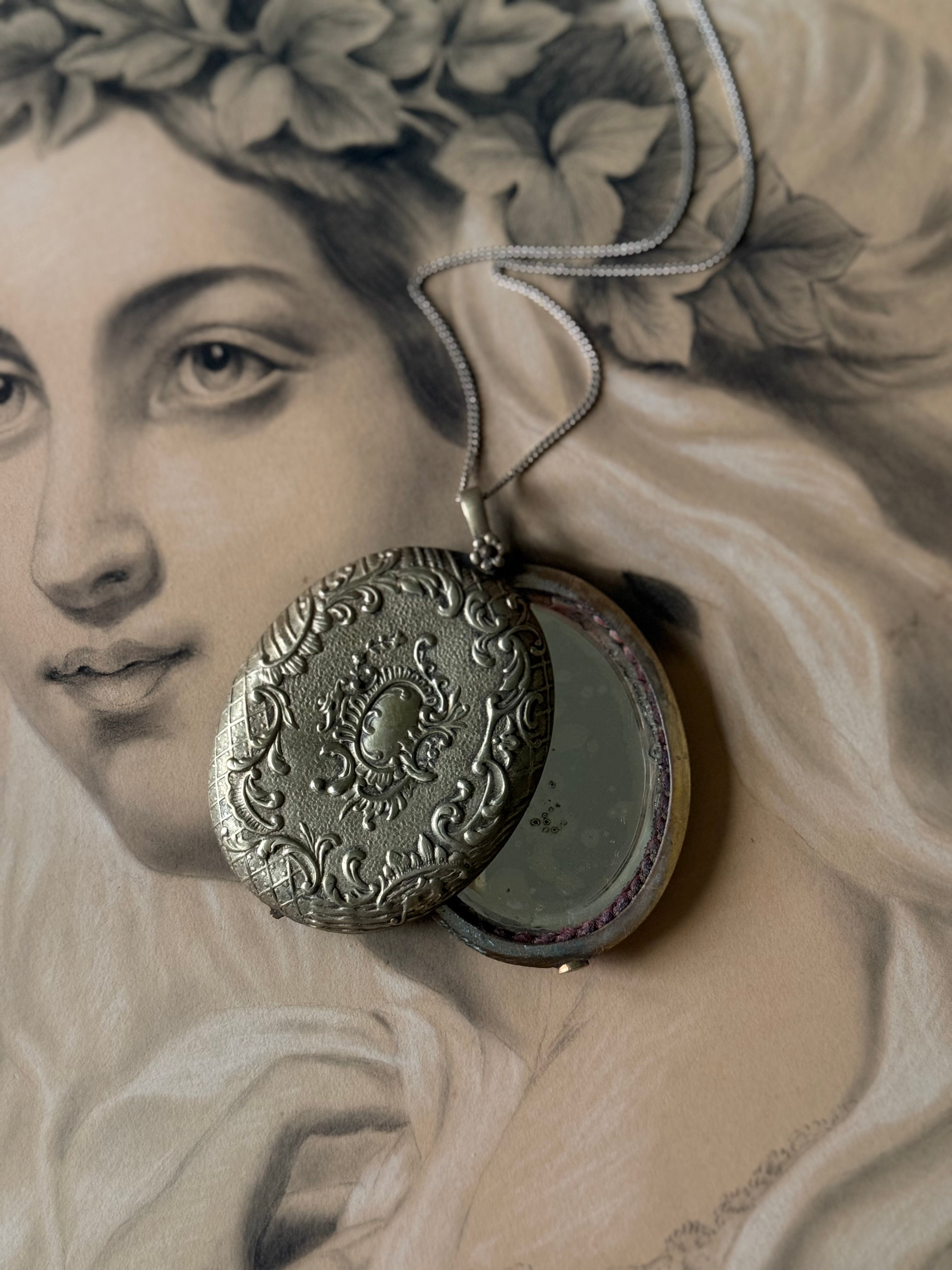 rare turn of the century French silver & brass repousse mirrored slide locket