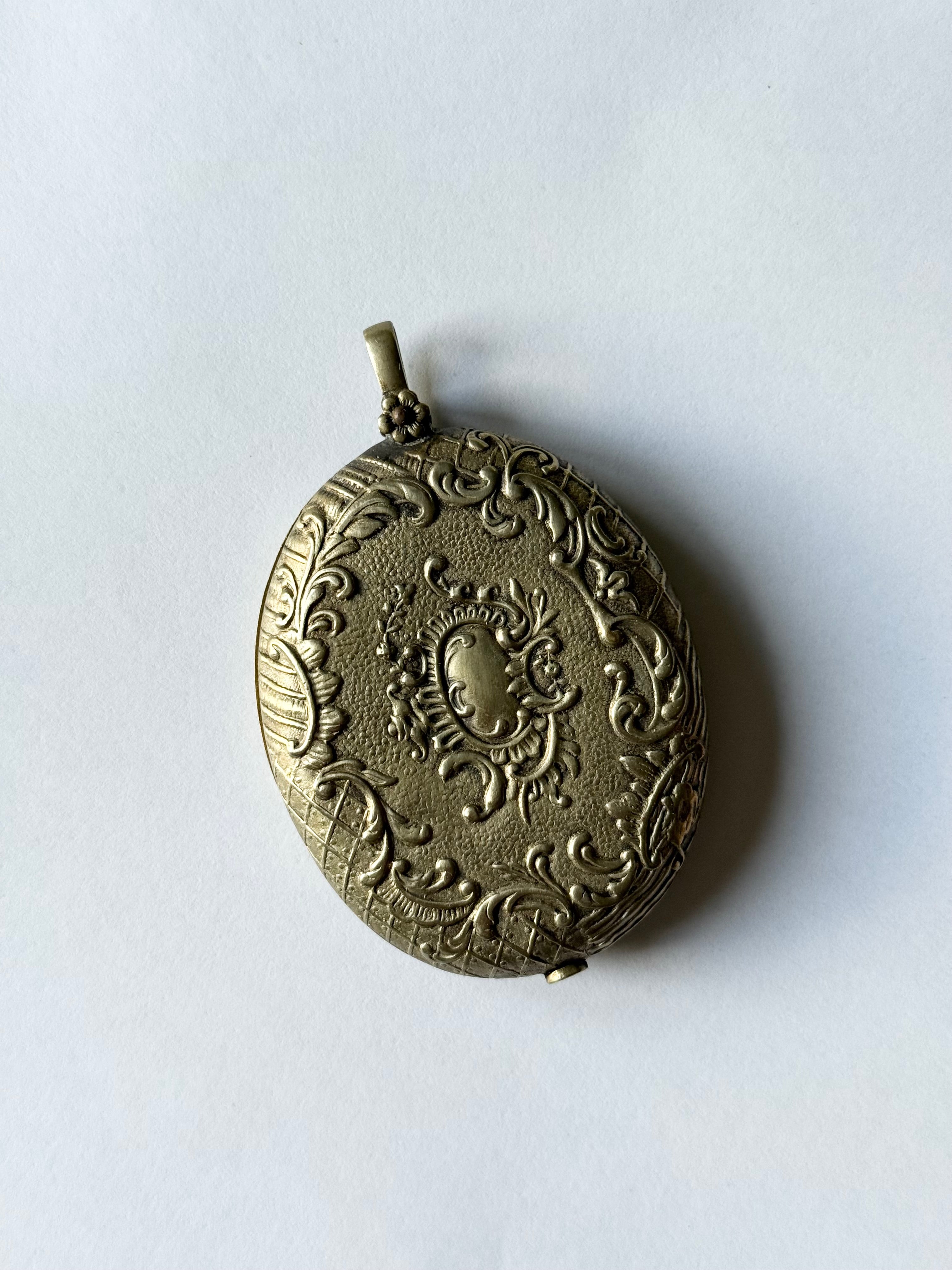 rare turn of the century French silver & brass repousse mirrored slide locket