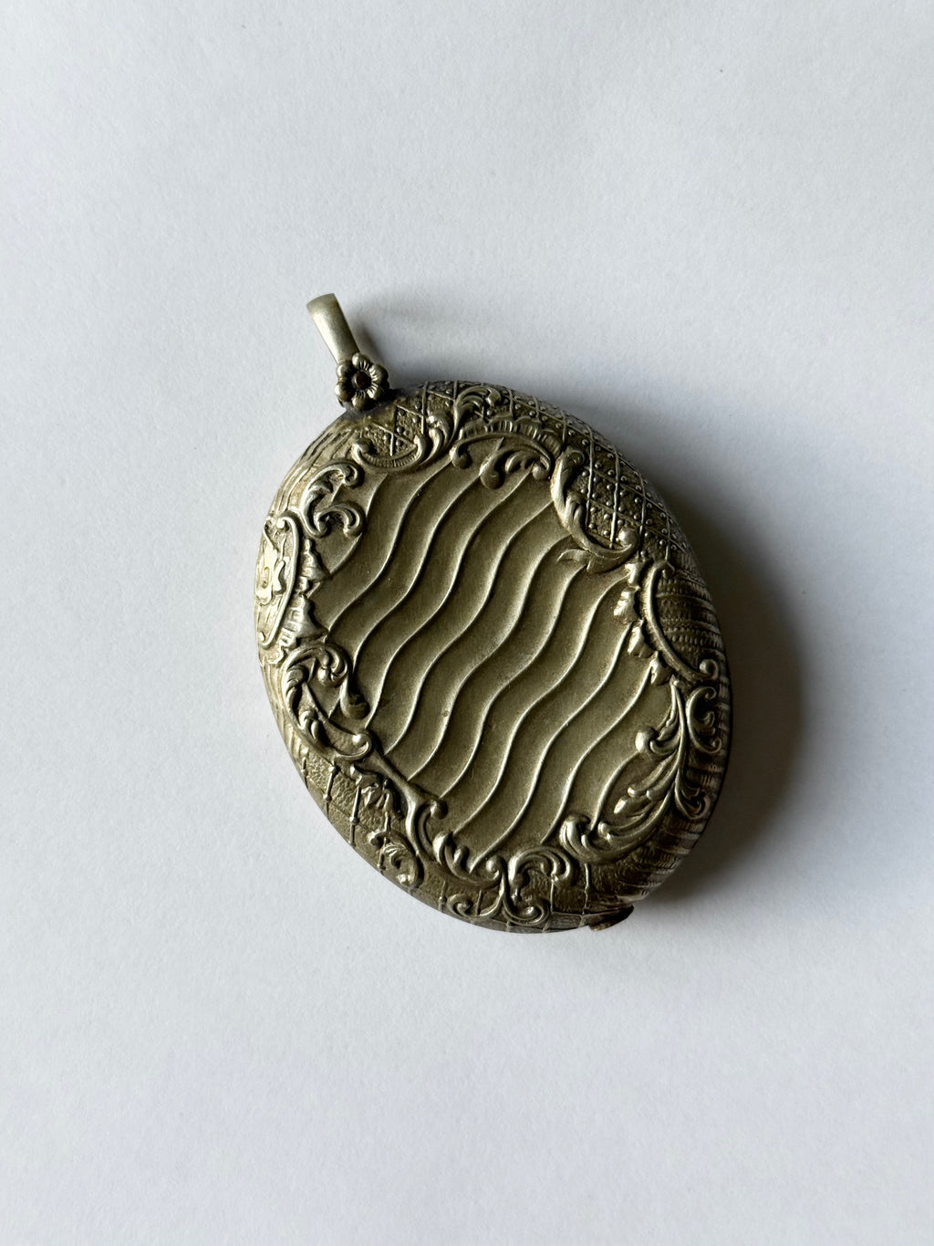 rare turn of the century French silver & brass repousse mirrored slide locket