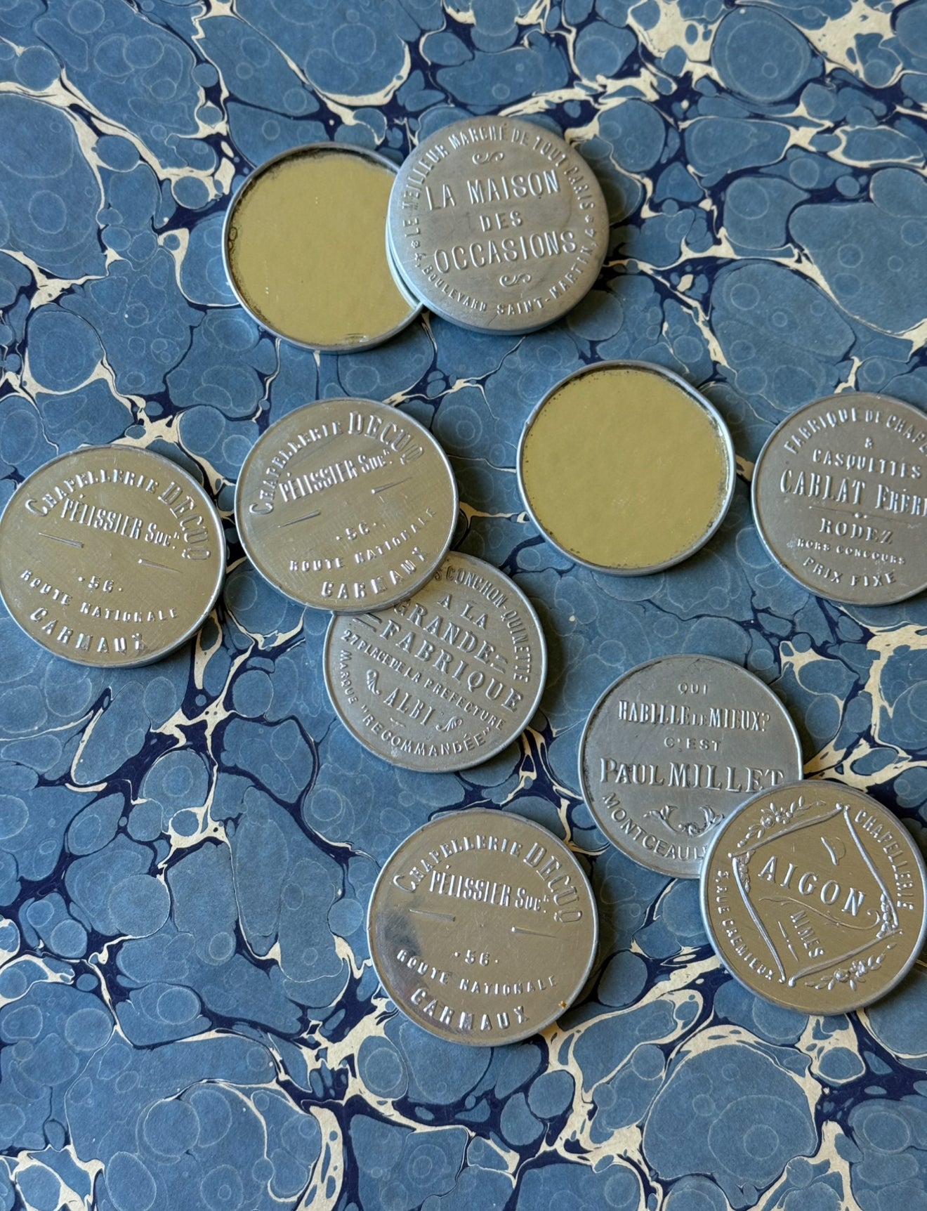 turn of the century French repousse aluminum advertising pocket mirrors