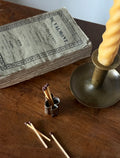 turn of the century French "trefoil" matchstick holder with striker