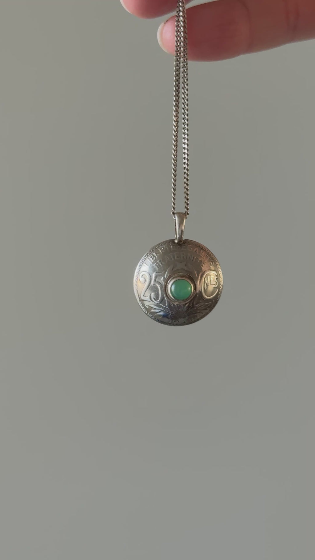 rare 1930s French bespoke folk art hand carved nickel coin "25 centimes" necklace with green cabochon