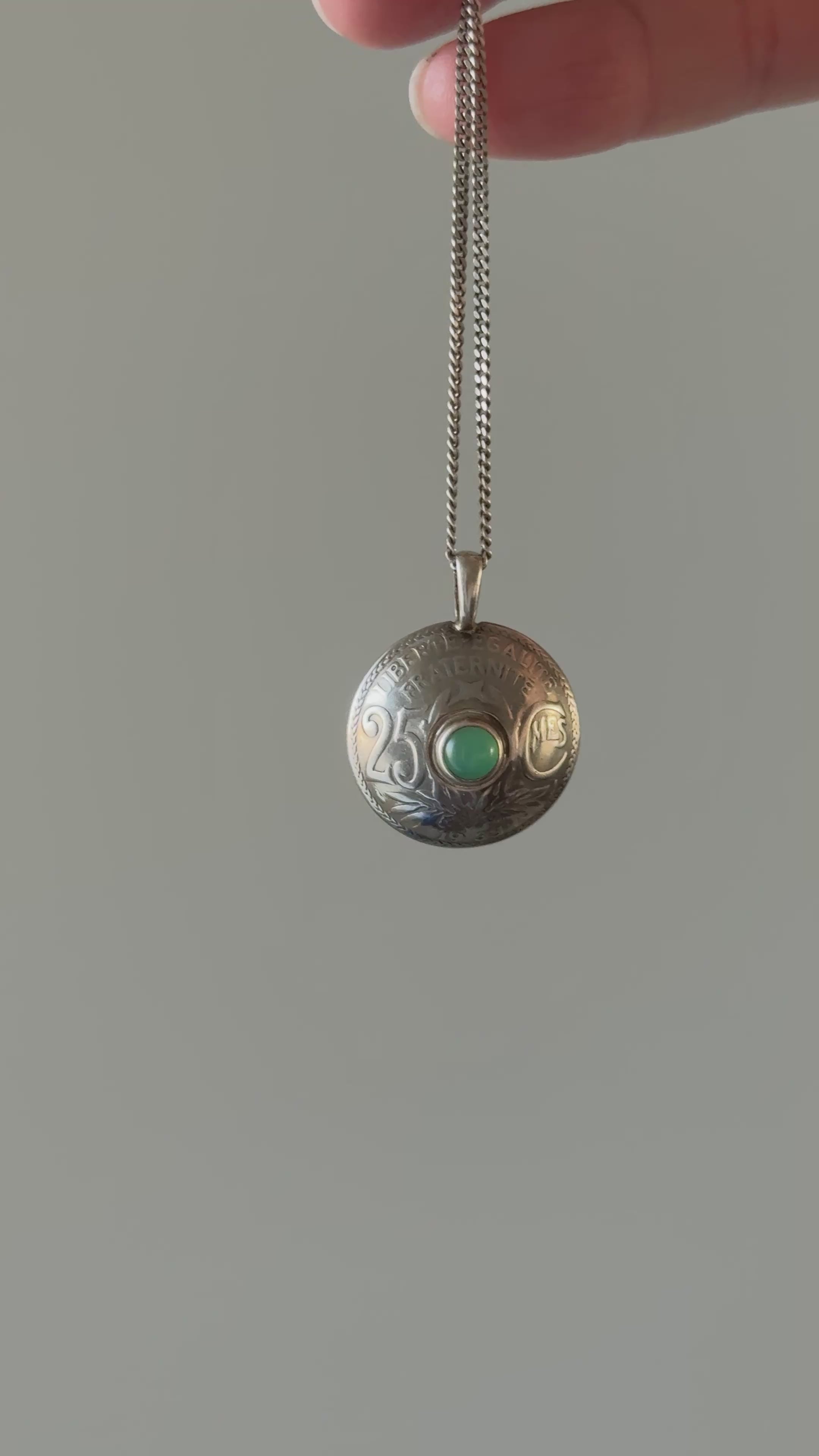 rare 1930s French bespoke folk art hand carved nickel coin "25 centimes" necklace with green cabochon